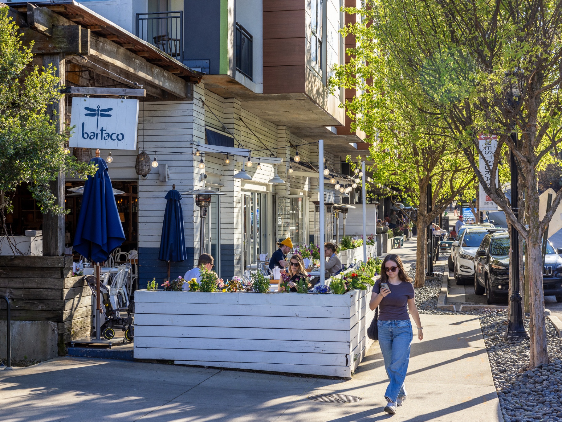 bartaco patio dining along the tree-lined sidewalk at Inman Quarter