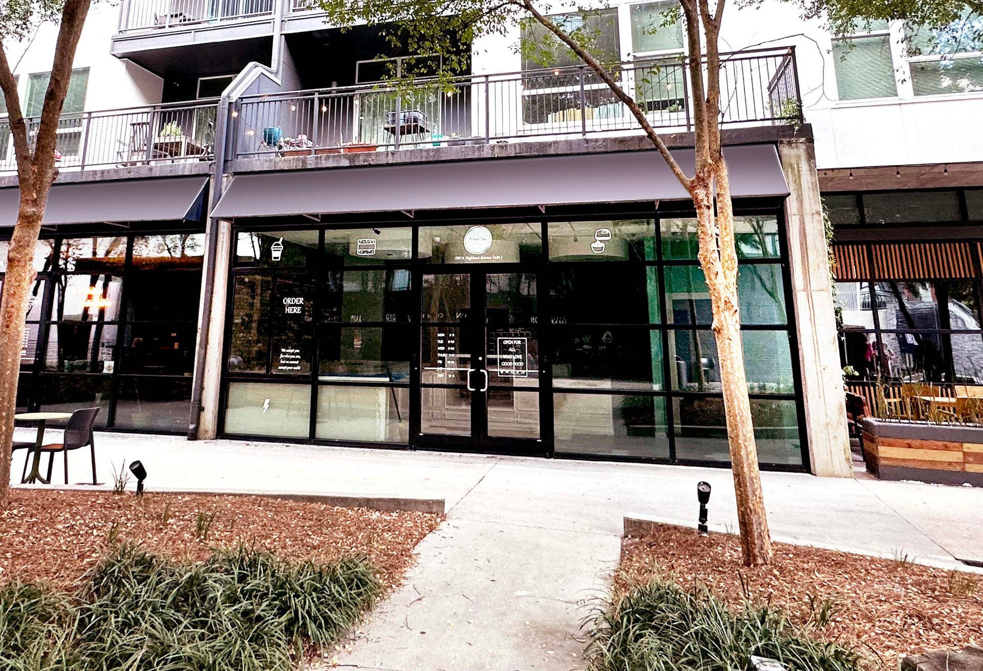 1,045 SF café storefront at Inman Quarter — floor-to-ceiling glass facade